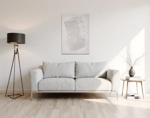 Leinwand in sehr hellen Beigetönen, das über einem hellen Stoffsofa hängt. In die Fläche ist die Zahl Eins durch ein Raster gespachtelt. | mixed-art - wolfram schäfers