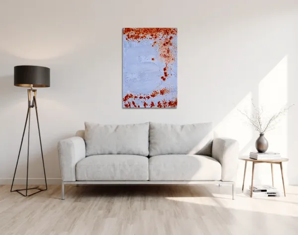 Leinwand mit aktivierter Acryloxydmischung von links und verschieden farbigen Acrylfarben. In die Fläche ist die Zahl Zwei durch ein Raster gespachtelt. Das Bild hängt in einem Raum über einem Sofa. | mixed-art - wolfram schäfers